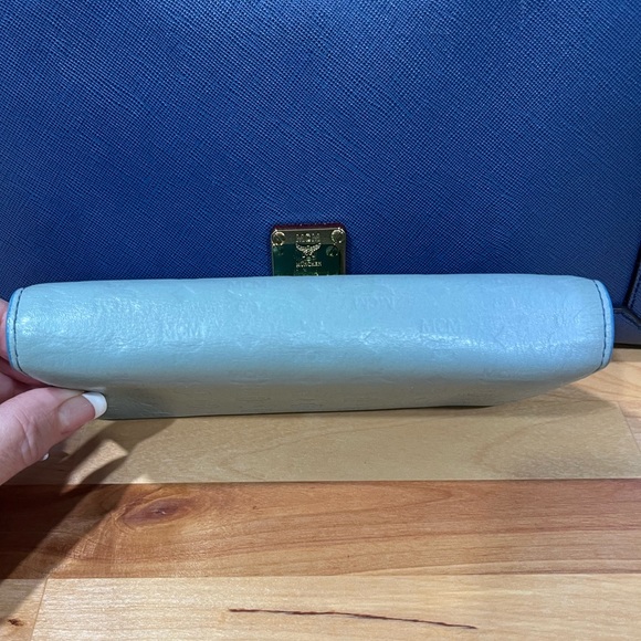 MCM Munchen trifold wallet in new condition except scratches on name plate. - Picture 10 of 15